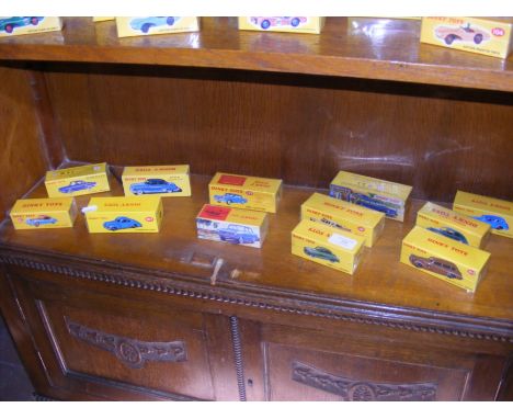 A selection of twelve new boxed reproduction Dinky toys