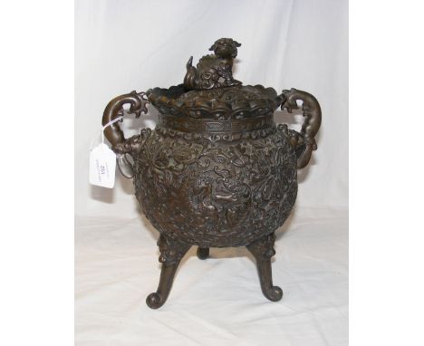 An antique bronze two handled Oriental vase and cover - 30cm high