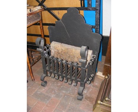 A cast metal fire grate and back - 82cm high