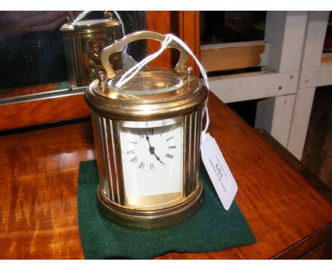 A small proportioned brass cased carriage clock - 9cm high