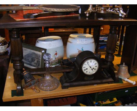 An oak cased Nelson's hat mantel clock, together with brass bell, ship's decanter and two ceramic spirit barrels, etc. 
