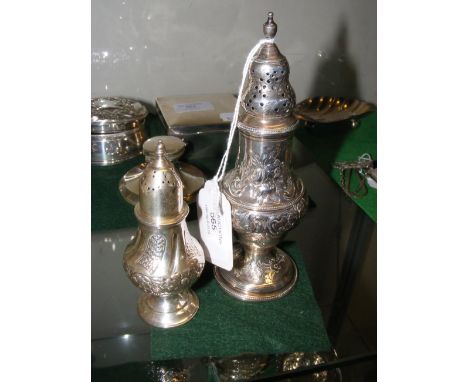 A 15.5cm high silver sugar shaker, together with a 10cm high silver pepperette