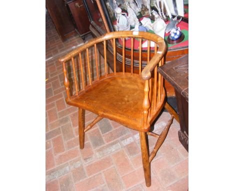 An antique Welsh style stick back Captains chair