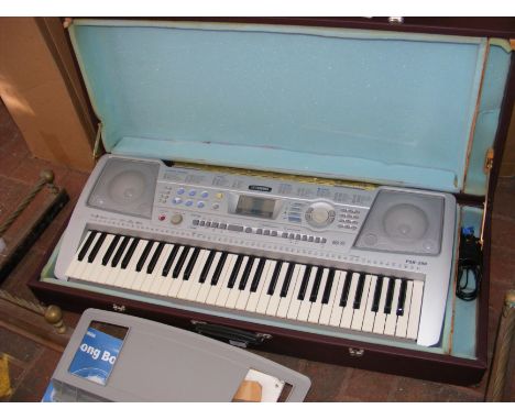A Yamaha PSR-290 electronic keyboard in hard carrying case