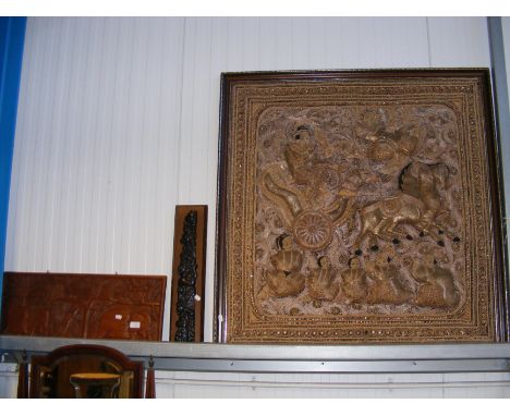 A Burmese embroidered Kalaga wall panel, together with two carved wooden panels 