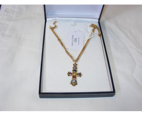A 9ct multi-jewelled cross pendant including amethyst and sapphire on 9ct chain