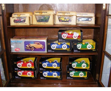 A quantity of Brio Racer toy cars, together with Models of Yesteryear and Rolls Royce Solid State model car - on three shelve