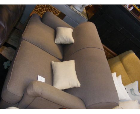 A contemporary two seater sofa in grey upholstery - length approx. 5ft