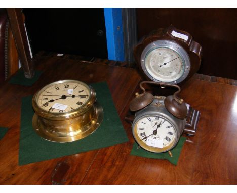 A 19cm diameter ships bulkhead clock, together with an old alarm clock and a compensated barometer