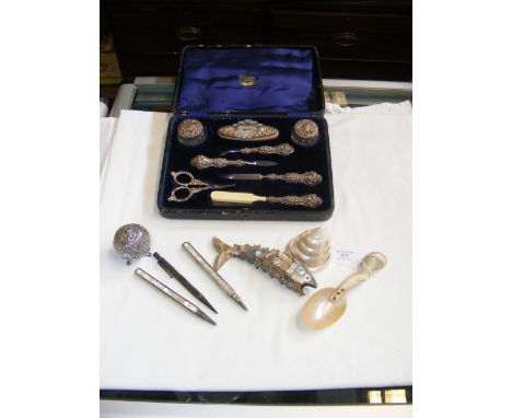 A small Indian silver pepperette, cased vanity set etc.