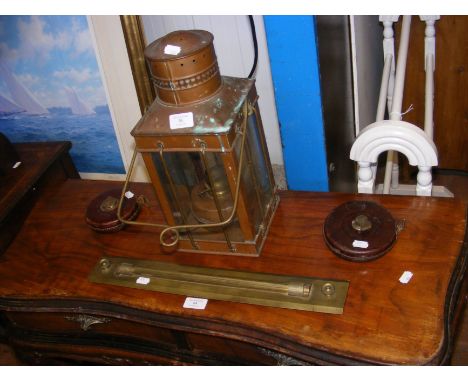 An old copper oil lamp, chart rule, together with two old tape measures 