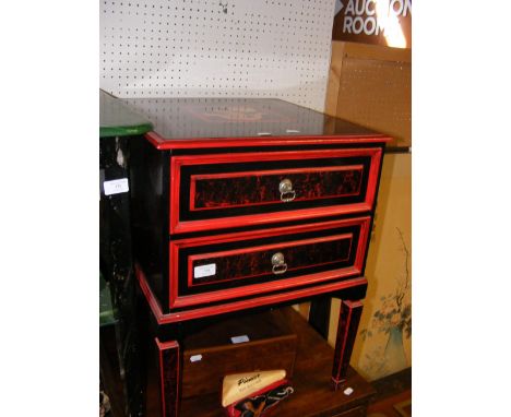 An Oriental style two drawer lacquered side table