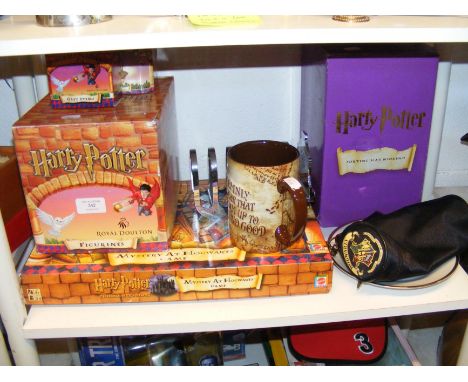 A quantity of Harry Potter memorabilia, including Sorting Hat bookends and Hogwarts Express toast rack  