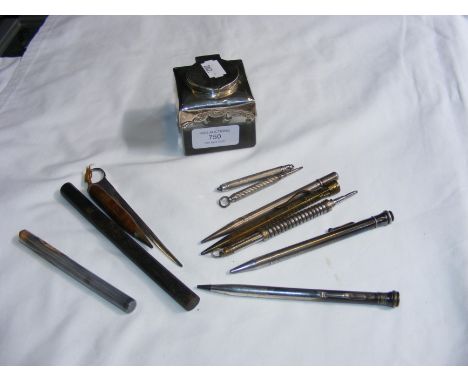 A silver top inkwell, propelling pencils