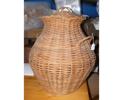 A painted black Bentwood hat and coat stand, together with a cane 'snake charmer's' basket 