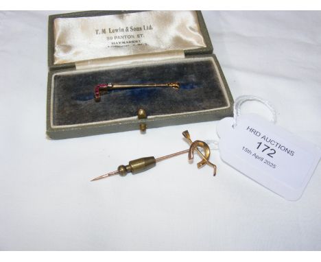 A ruby and diamond mounted 'riding crop' brooch, together with one other tie pin