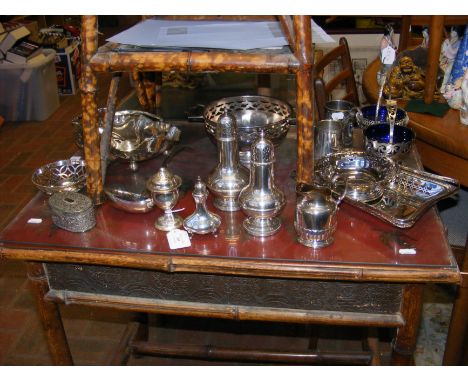 A quantity of silver plated serving ware including spice shakers and ladle