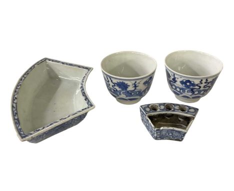 Four pieces of 18th/19th century Chinese blue and white porcelain including a pair of tea bowls, with waxed seals to the inte