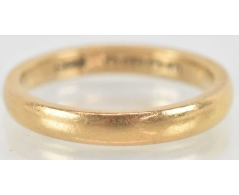 A 22ct yellow gold wedding band, size K, approx 4g.