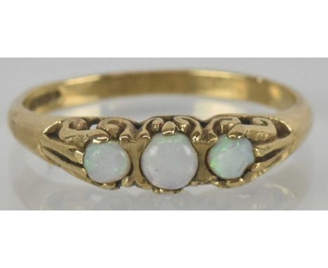 A 9ct gold ring, with three graduated small opal beads to the top, size N, approx 2g.