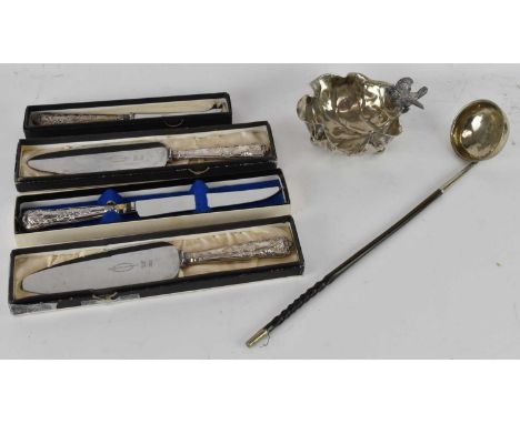 Four cased silver plated fish servers, a silver plated bonbon dish modelled as a folded leaf, with handle decorated as perche