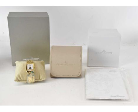 JAEGER-LECOULTRE; a gentleman's 18ct gold Reverso wristwatch, the white enamel dial set with raised baton markers between Rom