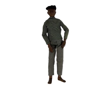 A late 19th/early 20th century artist's articulated lay mannequin of small size, with carved head and facial features, carved