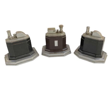 RONSON; a 1930s Art Deco chrome and bakelite table lighter, height 8.5cm, width 9cm, and two further Ronson black bakelite an