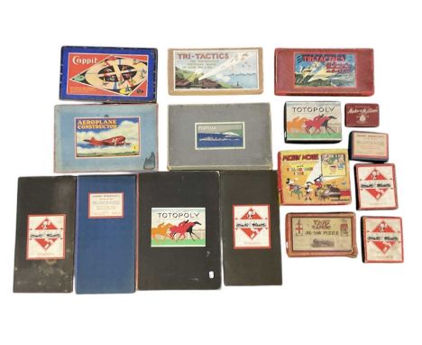 A quantity of early 20th century to mid 20th century vintage board games including Monopoly, jigsaw puzzles, Tri-Tactics, Mak