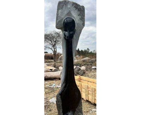 A large African carved springstone and cobalt figure of a lady with long neck, signed verso 'B.T.S', height 260cm.Footnote: B