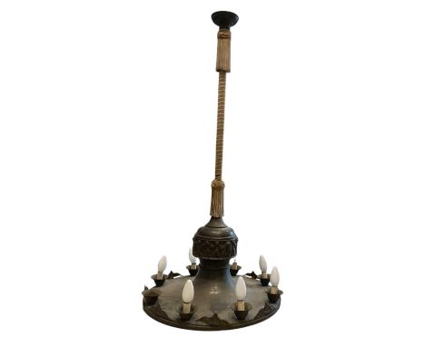 A bronzed metal eight branch ceiling light, decorated with cherubs, height approx 102cm.