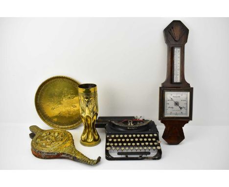 A group of mixed collectables comprising a Remington typewriter (lacking case), a brass trench art poker stand with collapsed