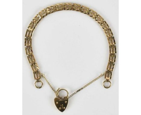 A 9ct gold three bar gate bracelet, with 9ct gold heart shaped padlock clasp, approx 9.4g.