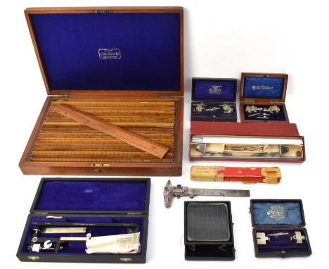 A collection of various engineering, draughtsman and technical drawing implements including a cased fixed arm planimeter by C