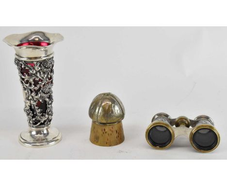A sterling silver floral decorated trumpet vase, with red glass liner, height 15.5cm, a pair of silver plated opera glasses, 