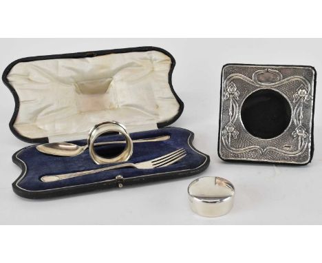 COOPER BROTHERS &amp; SONS LTD; a cased George V hallmarked silver christening set comprising spoon, fork and napkin ring, Sh