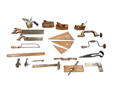 A collection of vintage tools and wood working tools including saws, planes, hacksaw, clamps, vices, etc.