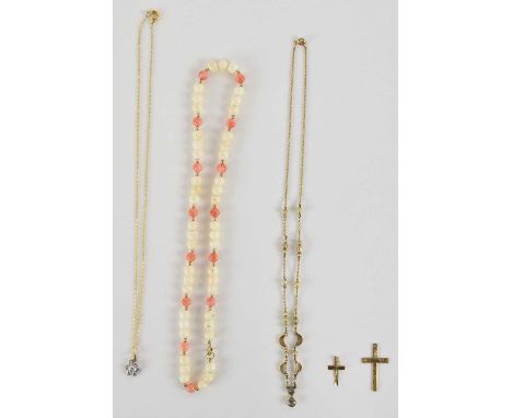 A 9ct yellow gold crucifix pendant, a smaller 9ct yellow gold crucifix pendant, a 9ct yellow gold fine link necklace suspendi