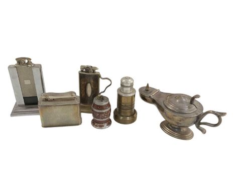 A collection of six novelty table lighters comprising a Dunhill lighter modelled as a genie's bottle, height 9cm, length 17cm