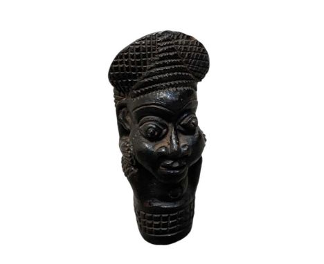 An African terracotta Bamum or Bamileke pipe, with figural decoration, height 20cm.