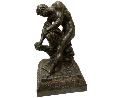 A 1920s spelter advertising figure for Phosferine 'The Greatest of All Tonics', modelled as a man splitting a tree trunk, hei