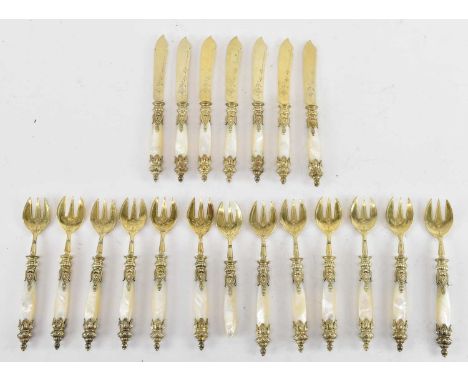 A set of twelve 800 grade silver gilt mother of pearl handled fish knives and forks (12).
