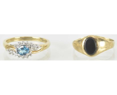 Two 9ct gold dress rings, one with centre blue stone within a white stone cluster, size N, the other example set with an oval