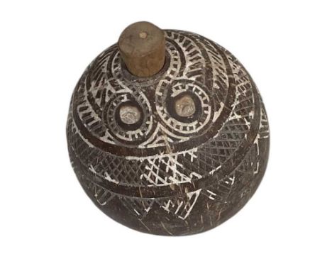 An Melanesian carved coconut flask, with white painted decoration, height 14cm.