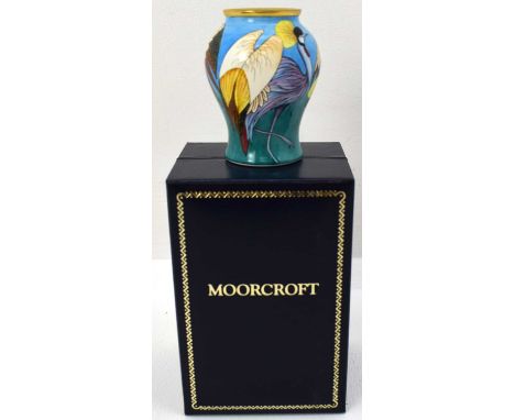 MOORCROFT ENAMELS LTD; a small 'Turu' pattern vase of baluster form, height 7cm, with presentation box and leaflet.