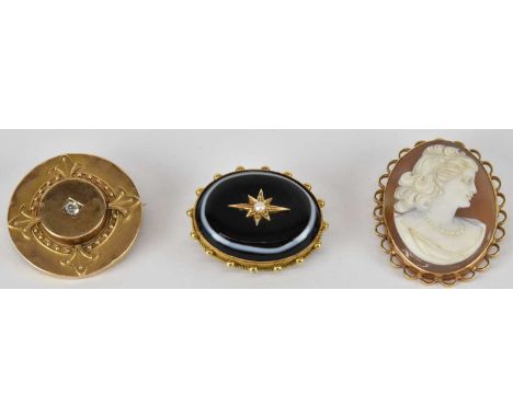 Three gold brooches comprising a 15ct gold mourning brooch, with seed pearl set in gold star in centre of banded oval agate, 