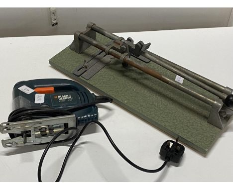 A Black and Decker jigsaw and ceramic tile cutter 