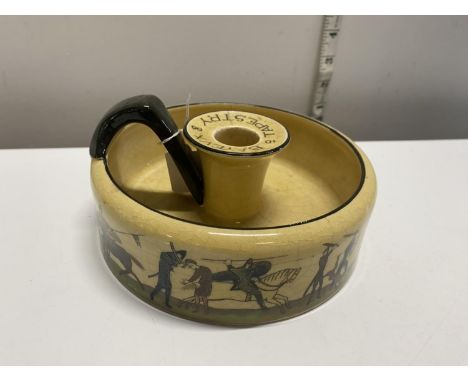 A rare 1920's Royal Doulton chamber stick depicting 'Bayeux Tapestry' 