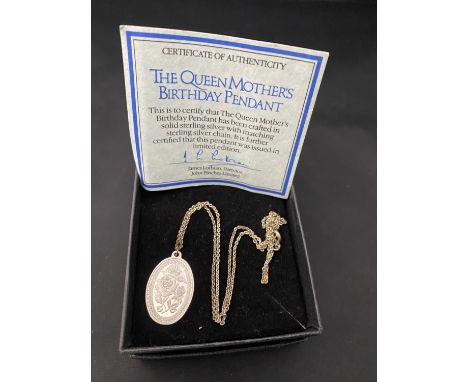 A silver Queen Mothers birthday pendant and chain 