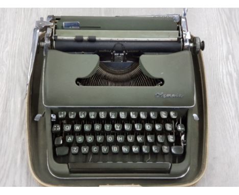 VINTAGE OLYMPIA TYPEWRITER IN CARRY CASE
